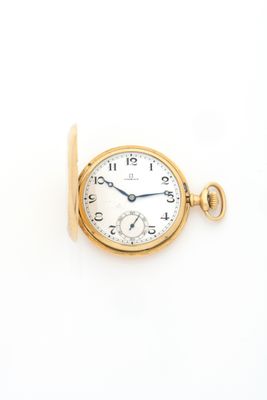 an image of a gold pocket watch with a chain on a white background