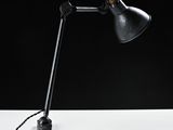 an image of a desk lamp with a wooden base and a black shade