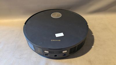 an image of a black vacuum cleaner sitting on top of a table