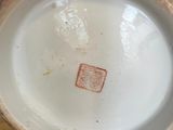 a close up of a bowl on a wooden table