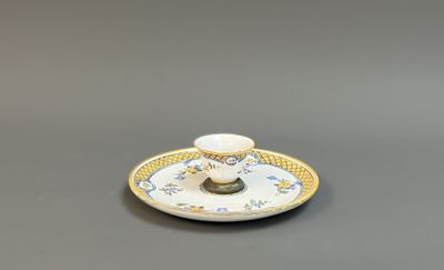 a small cup and saucer on a saucer