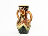 a vase that has a handle on it on a white background