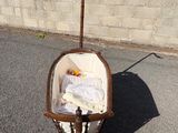 a baby in a crib in the middle of a parking lot