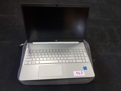 a laptop computer sitting on top of a bag