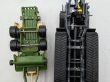 two toy vehicles that are sitting next to each other