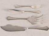 five forks and a knife on a white table