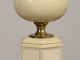 a lamp that is sitting on a table in the room