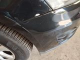a close up of a car that has a denting on it