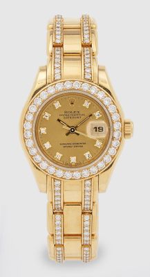 Montre Rolex pour femme en or jaune 18 carats sertie de diamants