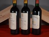 three bottles of wine sitting next to each other on a table