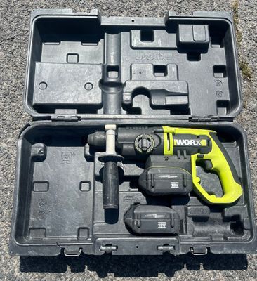 a tool in a case that is sitting on the ground