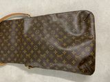 louis vuittoupe bag on a white surface