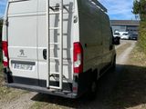 a white van that is parked on the side of the road