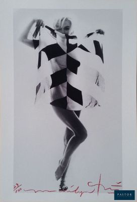 a black and white photo of a woman in a dress
