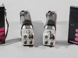 three different types of microphones sitting next to each other