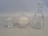 three glass vases sitting next to each other on a table