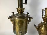 pair of antique brass urns with handles and handles on stands