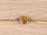 yellow gold plated bracelet with a heart charm on a chain