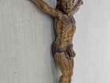 a statue of jesus on the wall of a building