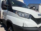 a white van that is parked in the parking lot