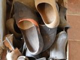 many pairs of shoes in a box on the floor