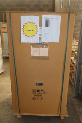 a cardboard box with a sticker on it in a warehouse