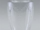 a clear glass vase sitting on a white surface
