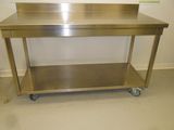 a stainless steel table with a shelf on it