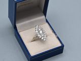 an image of a diamond ring in a blue box on a table