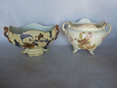 two vases sitting next to each other on a table