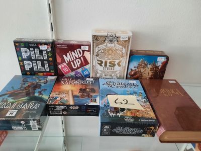 a lot of board games sitting on a glass table