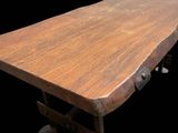 an image of a wooden table with wheels on a black background