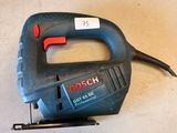 a corded jig saw sitting on a table