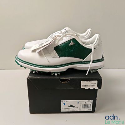 Chaussures de golf Nike avec des rayures vertes et blanches, présentées dans une boîte