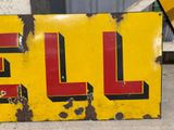 a yellow sign with the word sale written on it