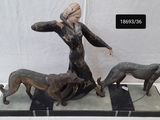 statue of a woman and two dogs on a marble base