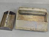 a small metal box with a handle and a small metal box with a handle
