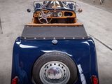 a blue car with a brown top parked in a parking lot