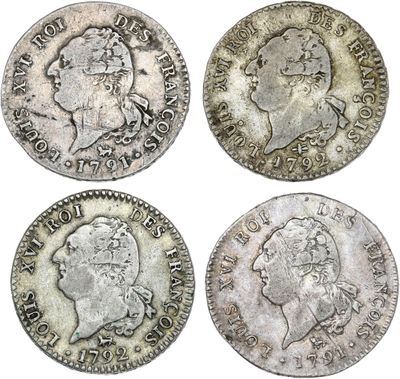 quatre types différents de pièces d'argent, dont l'une représente un buste et l'autre un buste