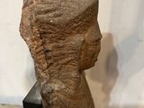 statue of a woman ' s head on a black stand