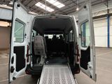 a white van with its doors open in a parking lot