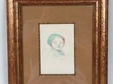 an old picture of a woman with a green hat in a gold frame