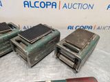 three old toasters are sitting on a table with a knife and a knife rest on top of them