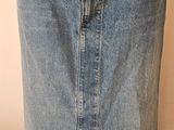 denim skirt with a buttoned front and a slit down the side