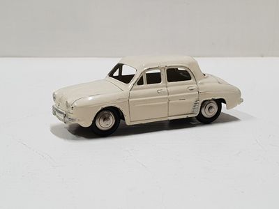 a toy car that is sitting on a white surface