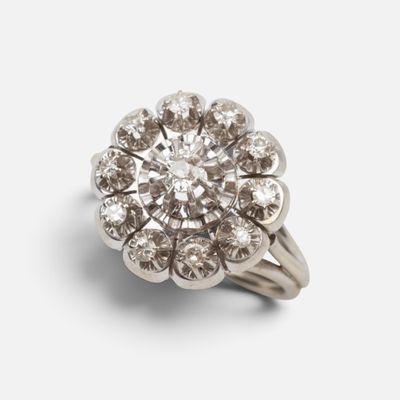 a close up of a diamond ring on a white background