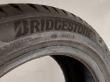 a close up of a tire on a white surface