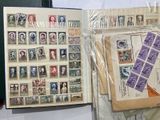 a book with stamps on it and a book with stamps on it