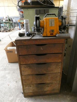 a cabinet that has a machine on top of it