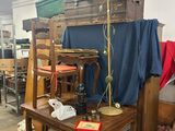 a table with a lamp on top of it in a room filled with furniture